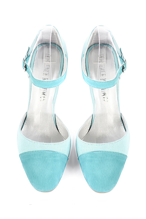 French elegance and refinement for these aquamarine blue dress open side shoes, with an instep strap, 
                available in many subtle leather and colour combinations. Its high vamp and fitted strap will give you good support.
To personalize or not, according to your inspiration and your needs.  
                Matching clutches for parties, ceremonies and weddings.   
                You can customize these shoes to perfectly match your tastes or needs, and have a unique model.  
                Choice of leathers, colours, knots and heels. 
                Wide range of materials and shades carefully chosen.  
                Rich collection of flat, low, mid and high heels.  
                Small and large shoe sizes - Florence KOOIJMAN